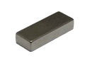 a small metal object on a black background