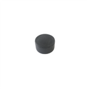 a white wall with a black knob on it