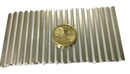 a gold coin sitting on top of a piece of metal