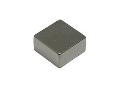 a square metal object on a black background