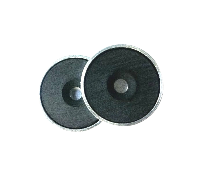 a pair of metal discs on a black background