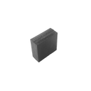 a rubber block sitting in front of a laptop
