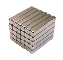 a stack of silver bars on a black background
