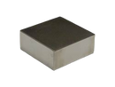 a square metal object on a black background