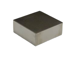 a square metal object on a black background