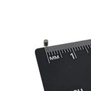 1.8mm x 2.5mm samarium cobalt rod magnet shown beside a ruler for scale