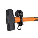 Magnetic locking clamp holding a club hammer by its orange handle against a steel surface