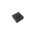 a small black object sitting on top of a white surface