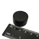 28.4mm x 15.7mm plastic coated neodymium disc magnet shown beside a ruler for scale