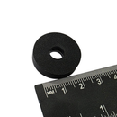 OD 25.4mm x H 6.3mm rubber coated neodymium ring magnet standing beside a ruler for scale