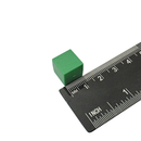 Green 13mm plastic coated neodymium block magnet shown against a measuring scale
