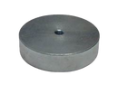 a round metal object on a black background