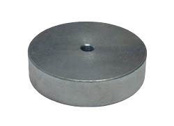 a round metal object on a black background