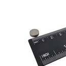 10mm x 3mm samarium cobalt disc magnet shown beside a ruler for scale