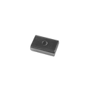 a square metal object sitting on top of a white surface