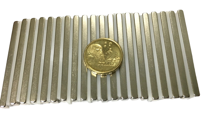 a gold coin sitting on top of a piece of metal