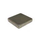 a square metal object on a black background