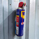 Blue magnetic spray can holder mounted on a steel wall holding an aerosol can