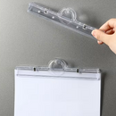 Clear magnetic acrylic holder with a hand holding it on a gray background
